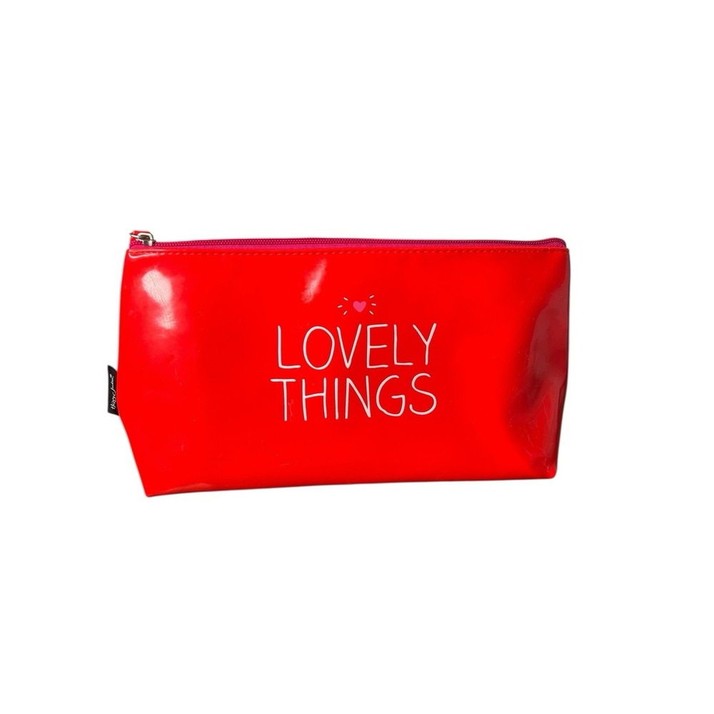 A red vinyl cosmetic bag by Happy Jackson